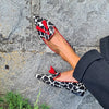 ANIMAL PRINT LOAFERS WITH RED FRINGES