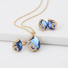 Blue crystal necklace + earring set in gold with blue crystal