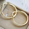 Gold earrings with a big impact