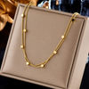 18-karat gold-plated collar with small squares