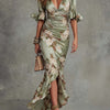 Anna | Asymmetrical long dress in green satin with V-neck, flared puff sleeves, and floral pattern